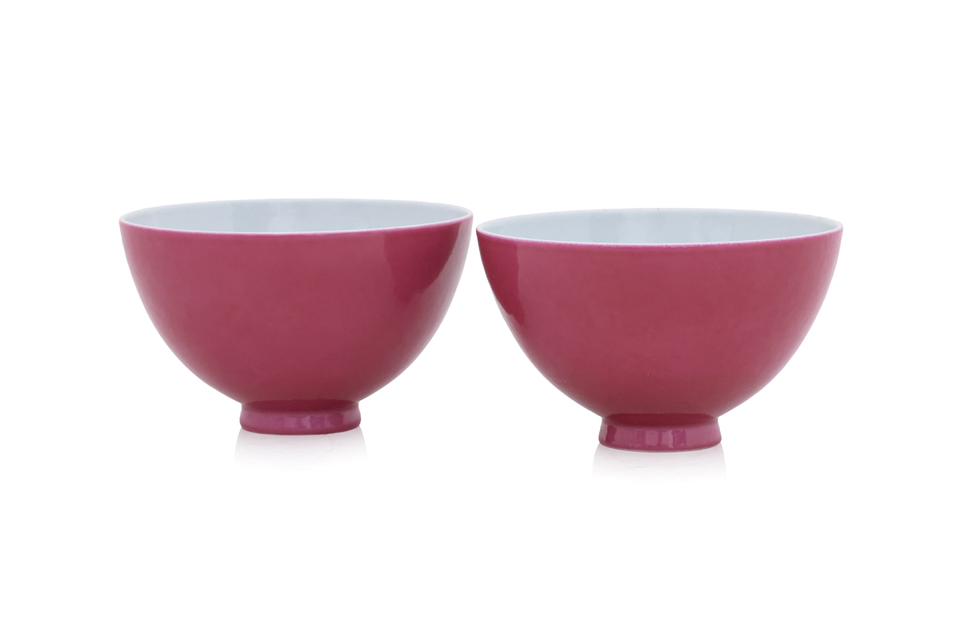 A PAIR OF RUBY GLAZED FAMILLE ROSE PORCELAIN TEA BOWLS