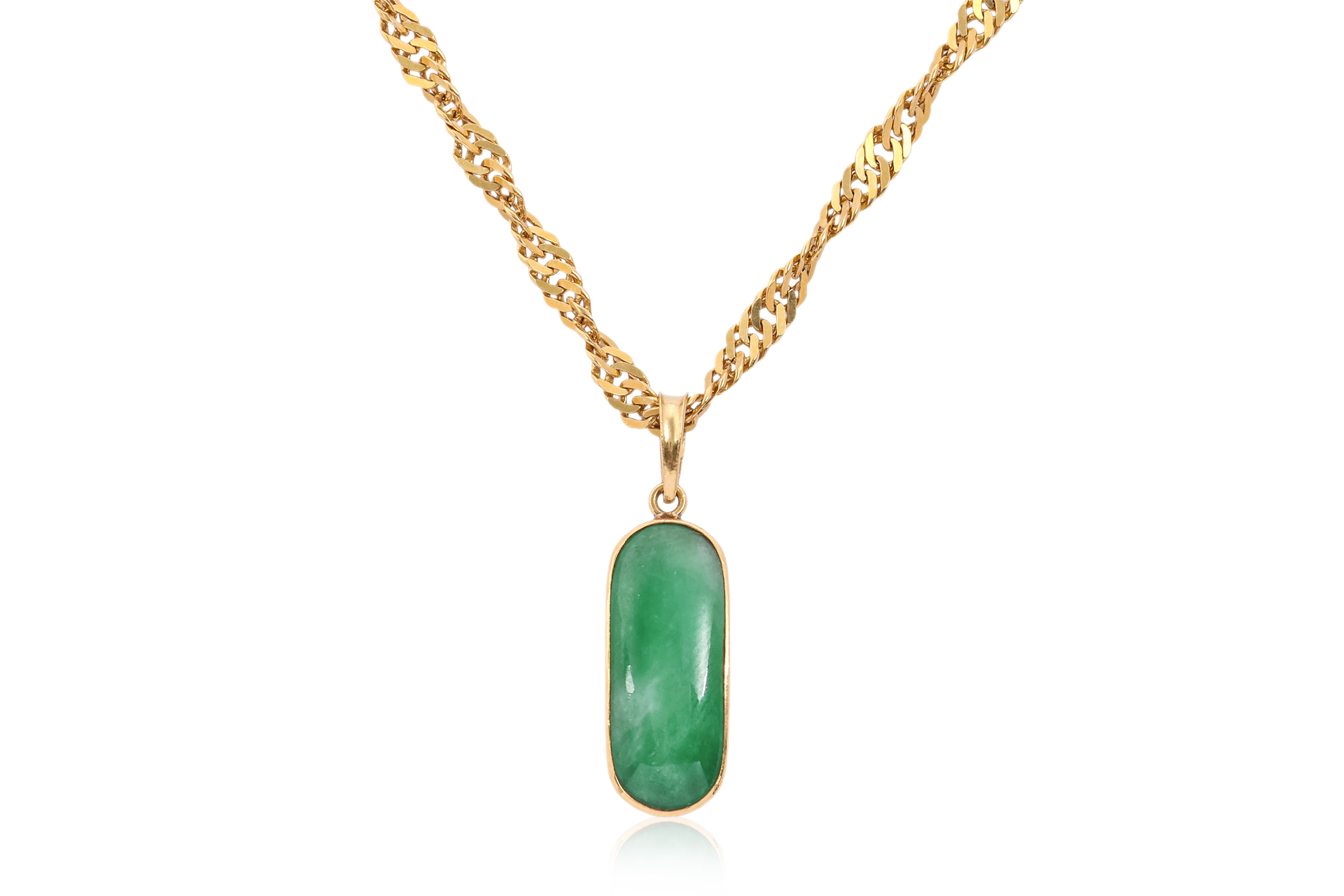 A JADEITE PENDANT ON A HIGH KARAT GOLD CHAIN