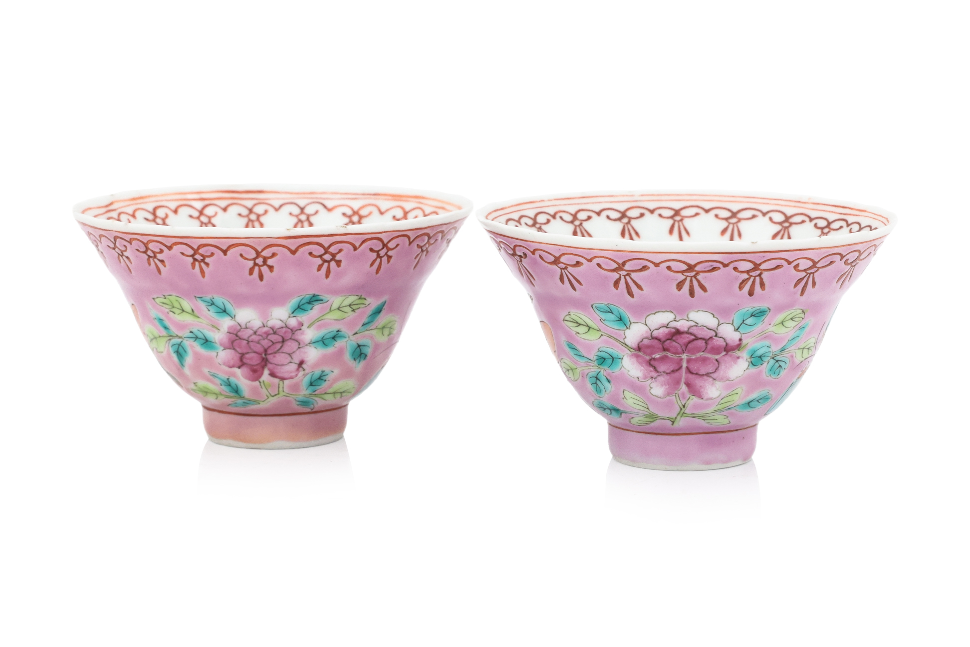 A PAIR OF PINK GROUND FAMILLE ROSE 'BUTTERFLY' TEA BOWLS