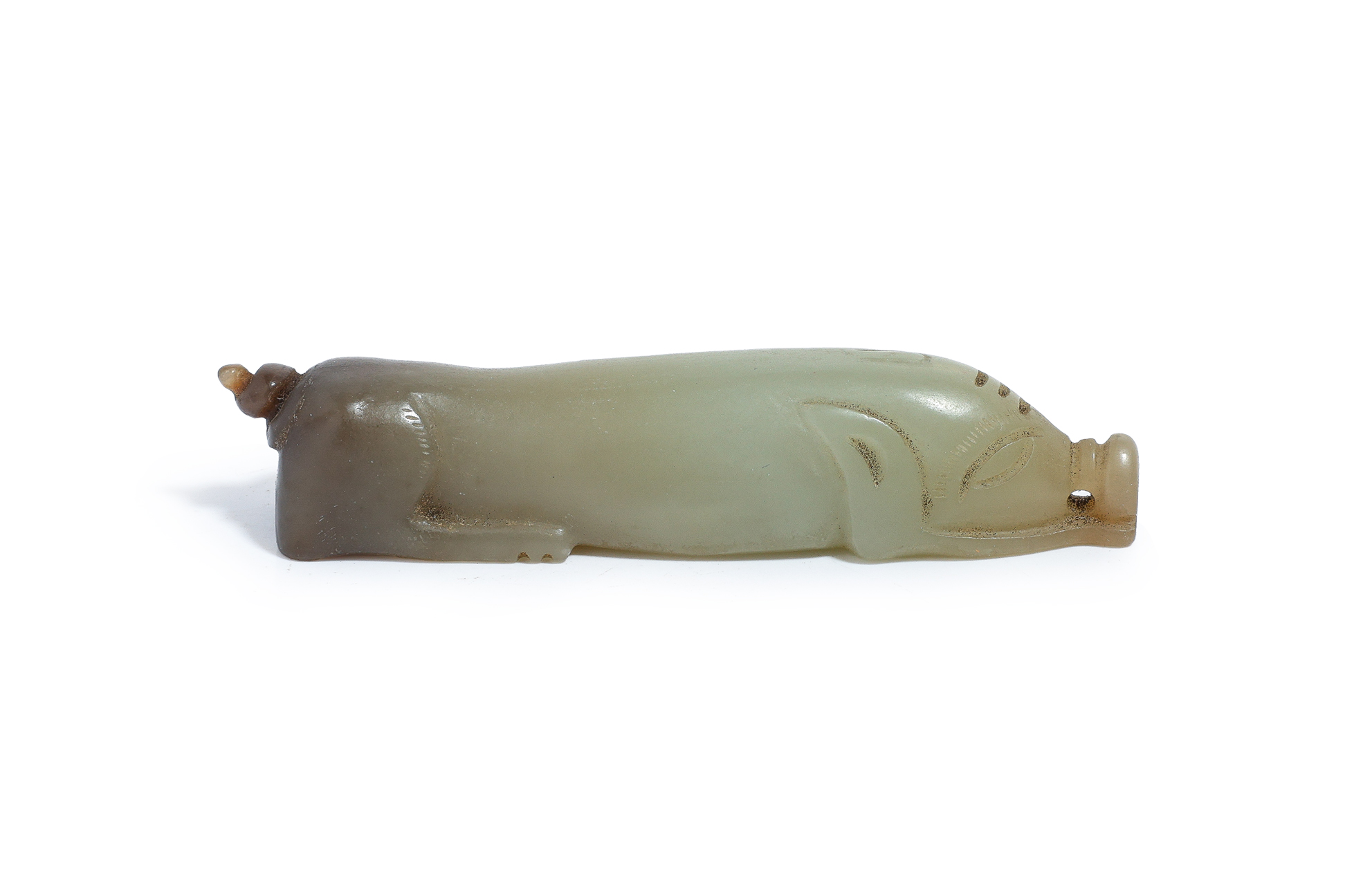 A CELADON JADE MODEL OF A PIG