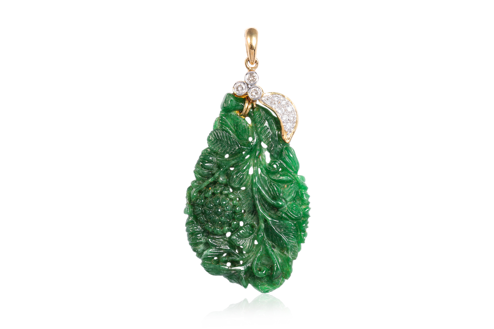 A CARVED JADEITE AND DIAMOND PENDANT