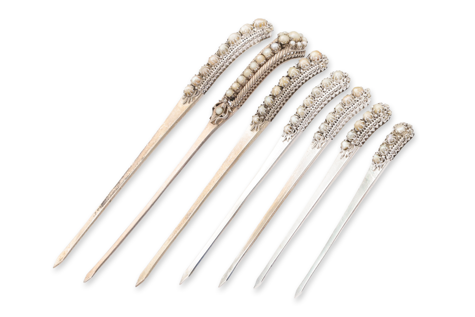 A SET OF SEVEN SILVER AND FRESHWATER PEARL HAIRPINS