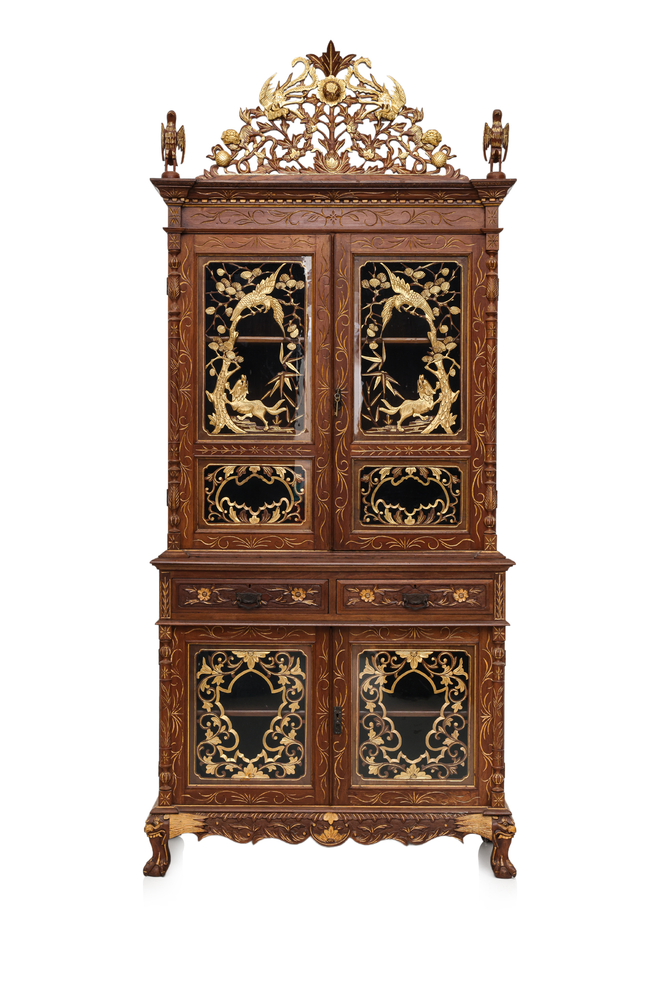 A LARGE CARVED AND PARCEL-GILT TEAK CABINET