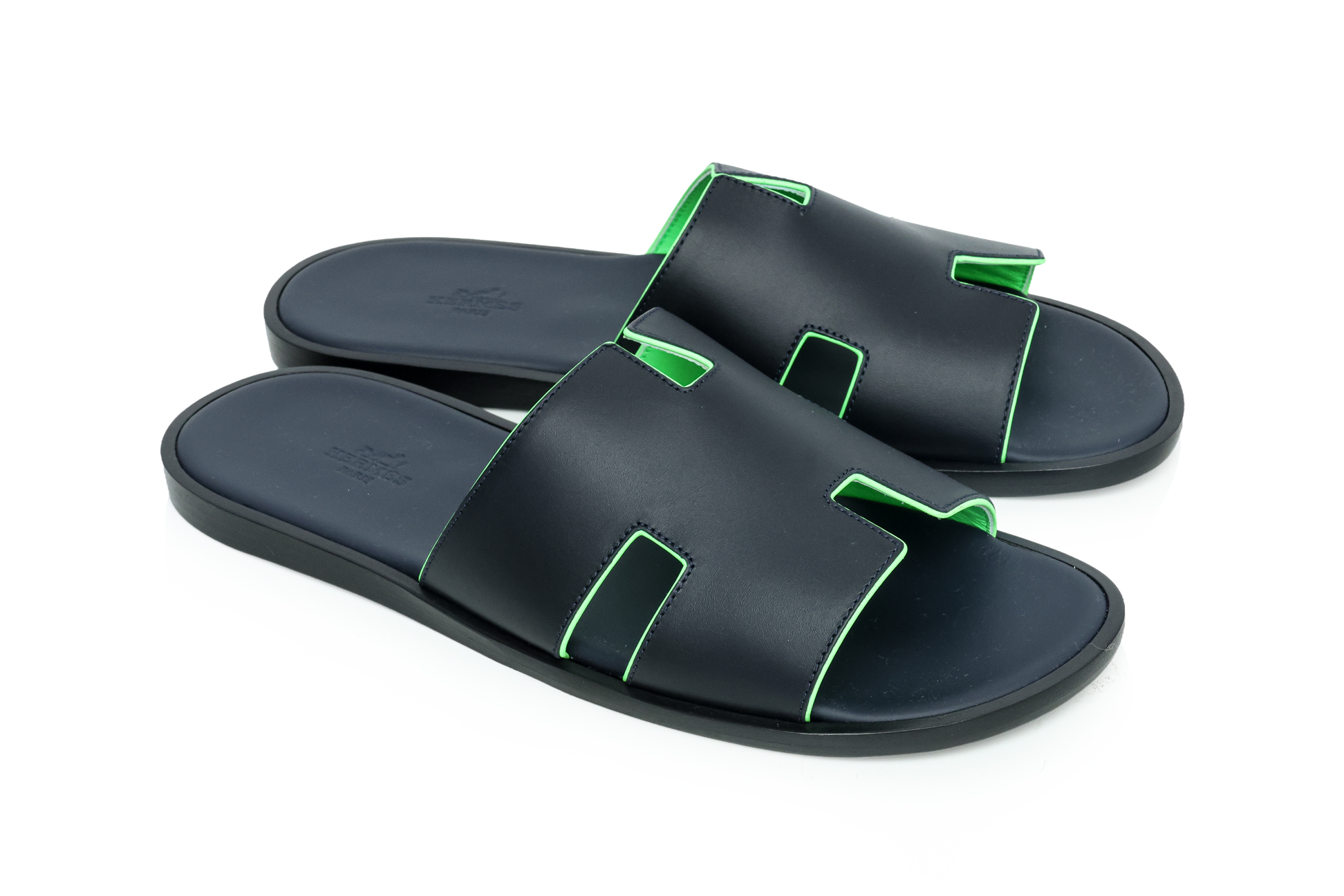 HERMÈS - A PAIR OF BLACK LEATHER 'ORAN' SANDALS, SIZE 43