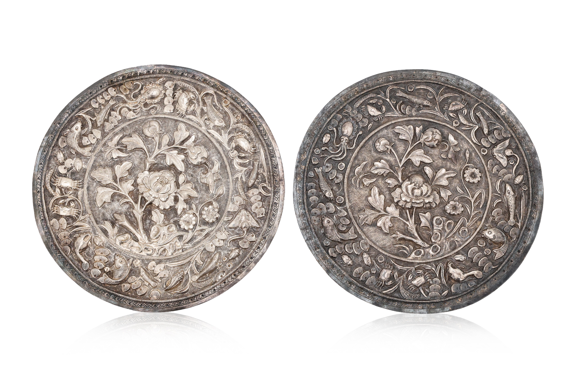 A PAIR OF SILVER PEONY DECORATED BOLSTER ENDS