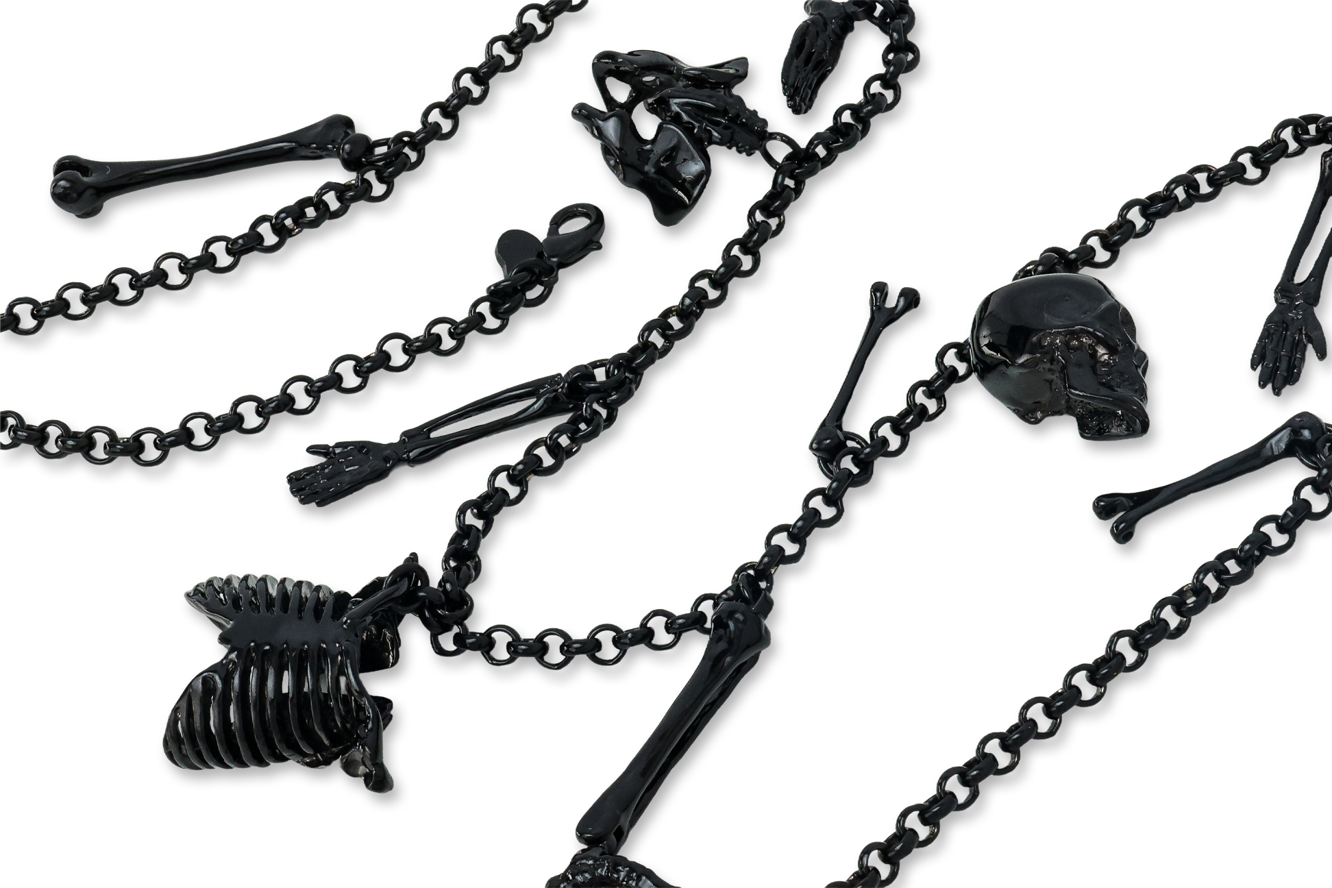 A BLACK METAL NECKLACE WITH SKELETAL AND ANATOMICAL CHARMS