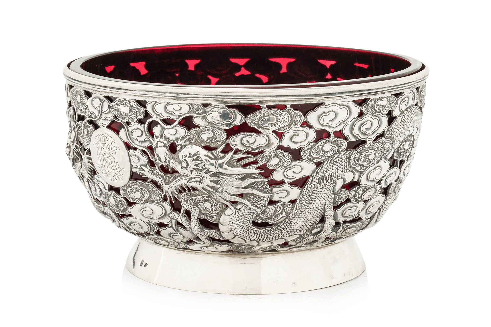 A CHINESE EXPORT PIERCED SILVER DRAGON BOWL