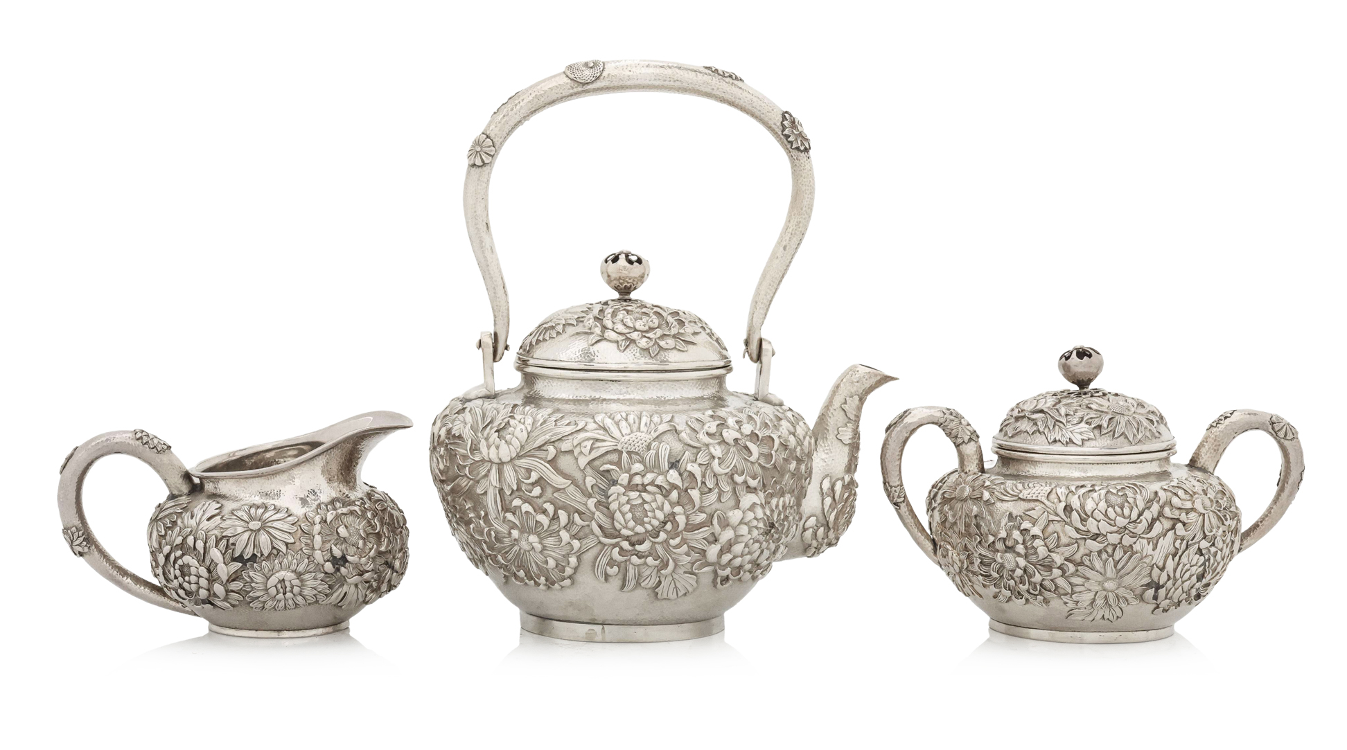 A JAPANESE EXPORT THREE PIECE SILVER TEA SERVICE BY ARTHUR & BOND
