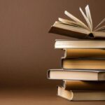 stack of books on a brown background concept for world book day photo