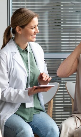 middle aged woman with skin cancer talking with her doctor 23 2148988521 340x570 1