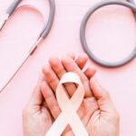 white awareness ribbon two hands with stethoscope pink background 23 2147863603 340x570 1