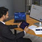 business person looking finance graphs 1024x683 8