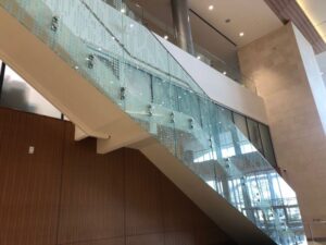 How Can Professional Glass Railing Restoration Revitalize the Clarity and Value of Your Coastal Property?
