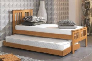 What Are the Benefits of Upholstered Guest Beds Over Standard Beds?