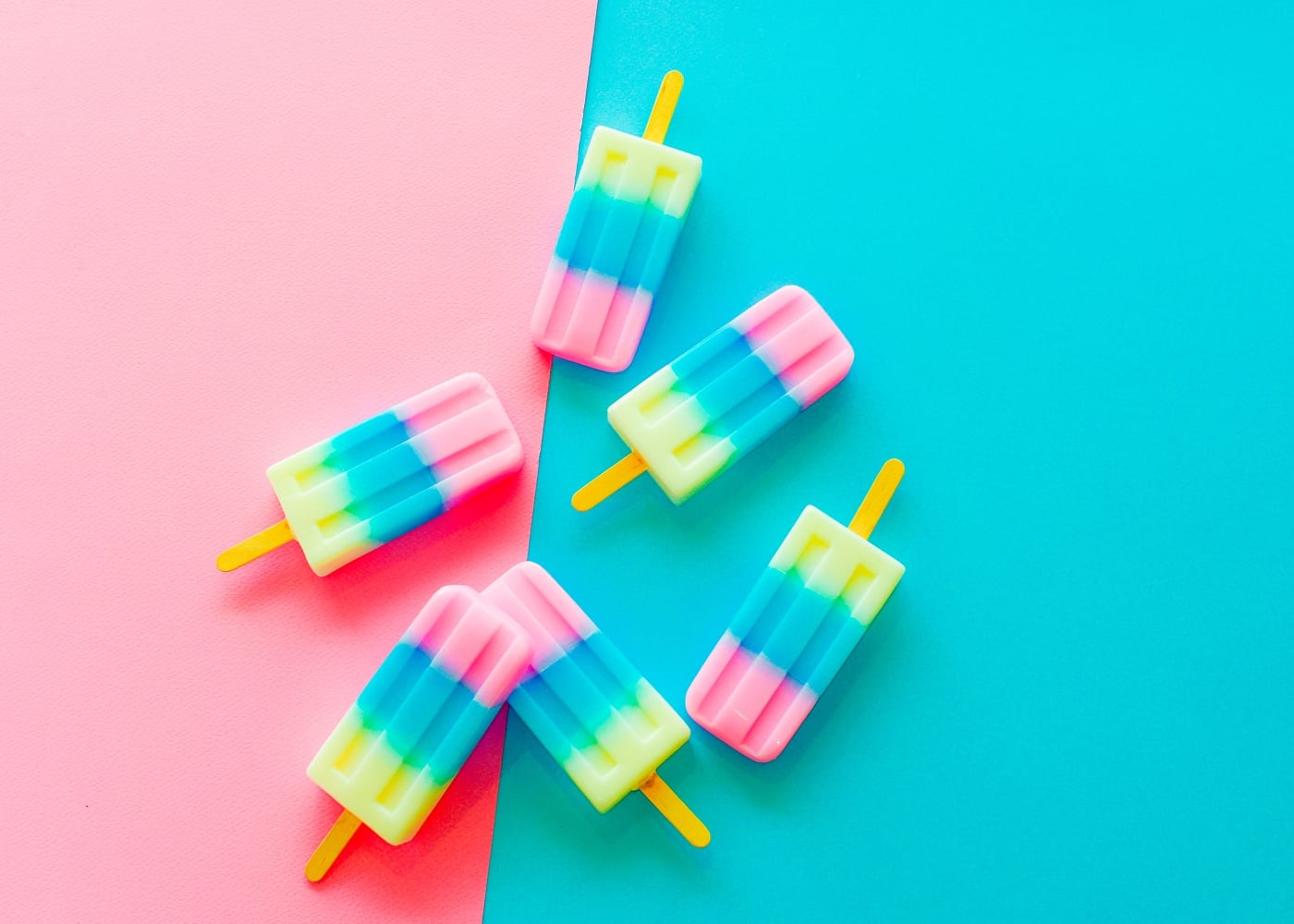 Frozen icy treats pastel coloured fruit popsicles