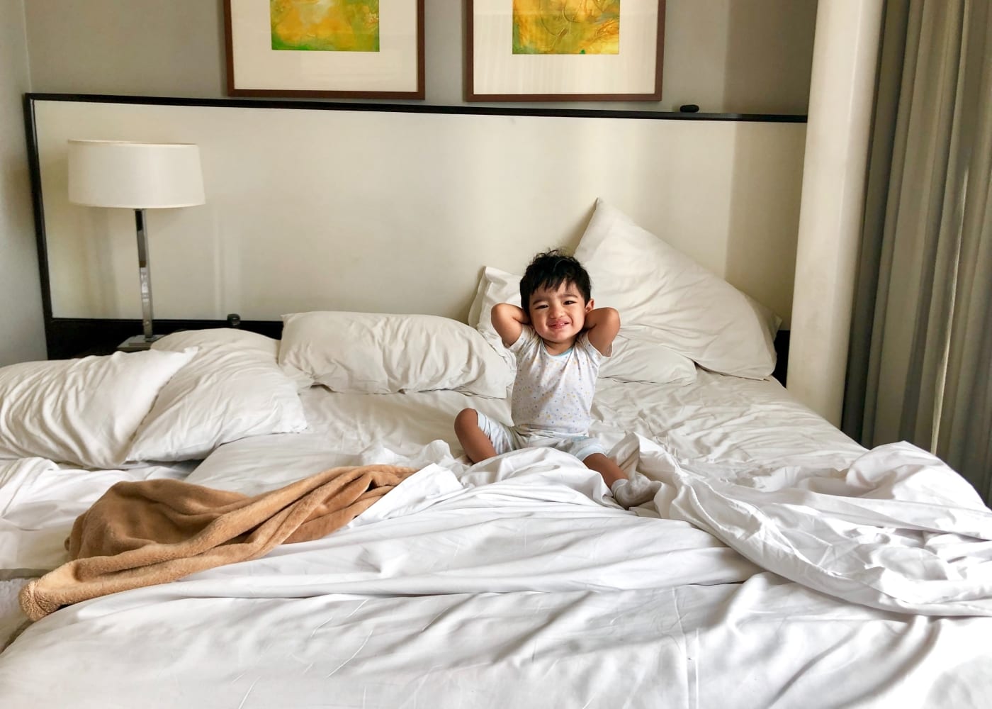 Child in bed photography by Reimond de Zuñiga via Unsplash