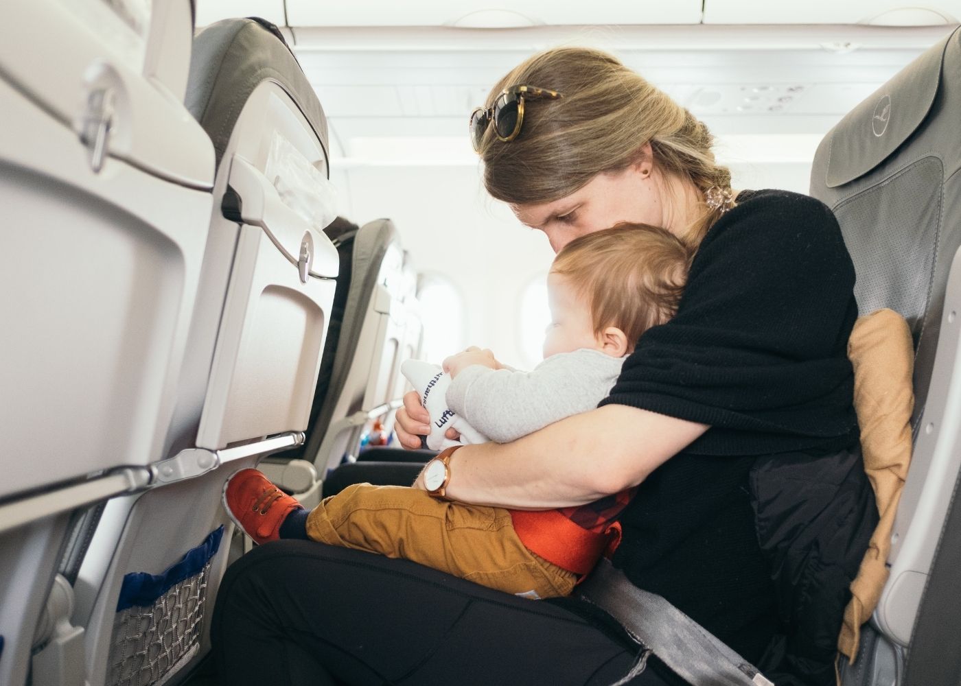 Travel gadgets and games for kids on planes: ride-on luggage, inflatable beds and wipe-clean cards!