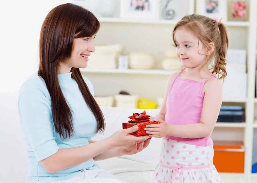 child giving a gift to an adult
