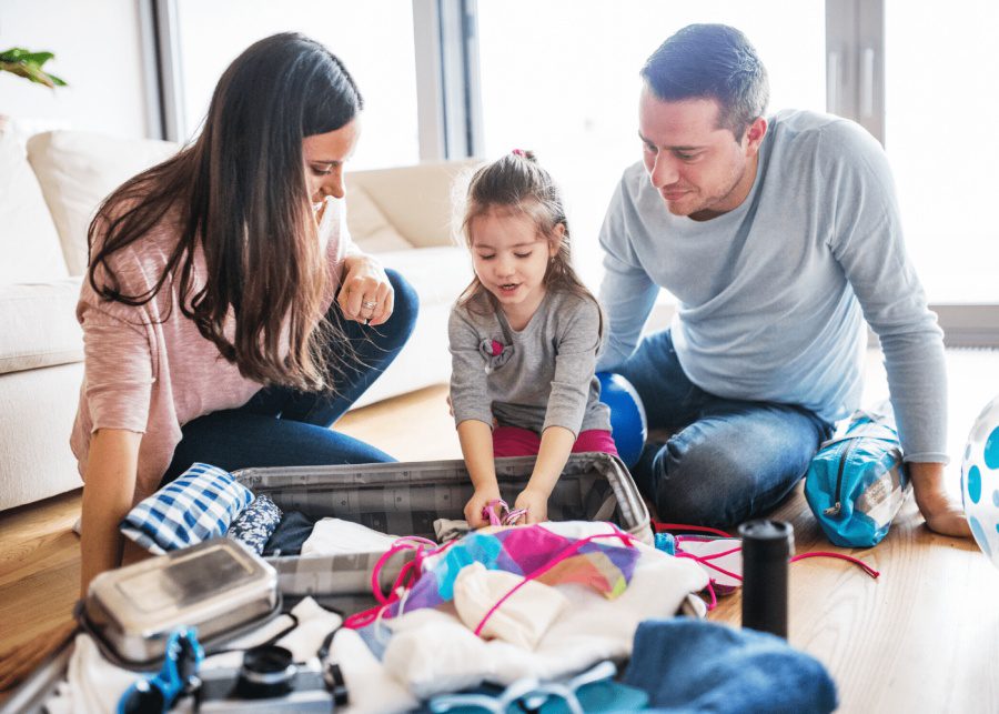A family packing their luggage for travel