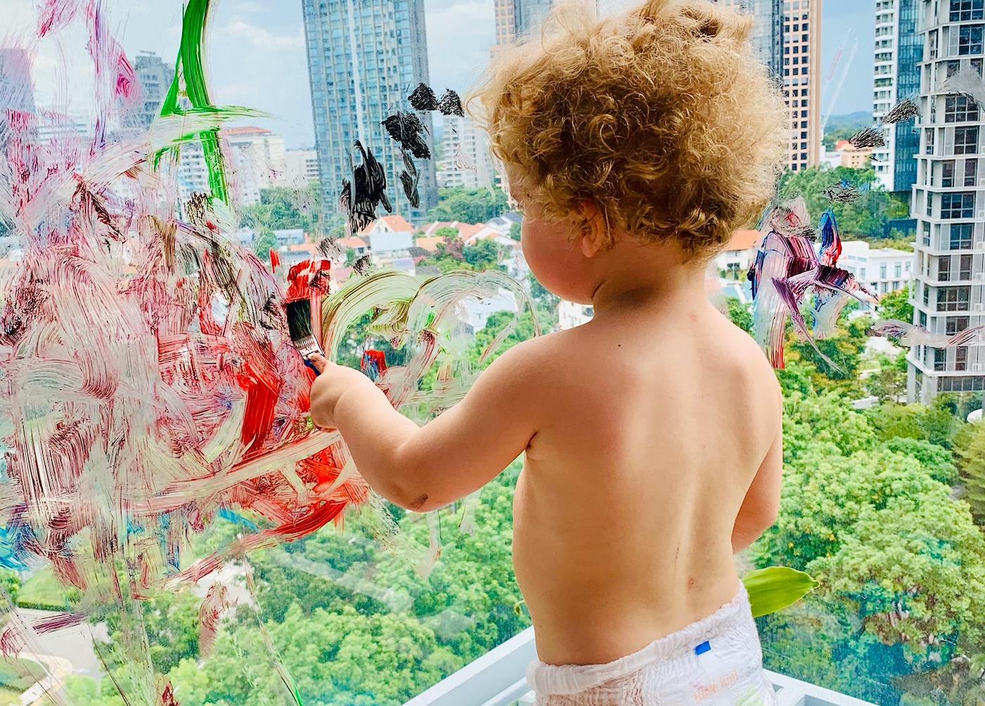 parenting Montessori Waldorf Reggio Emilia boy painting