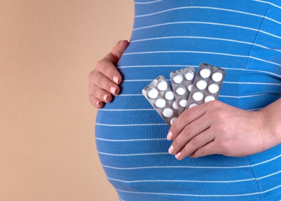 pregnant woman with medication treatment
