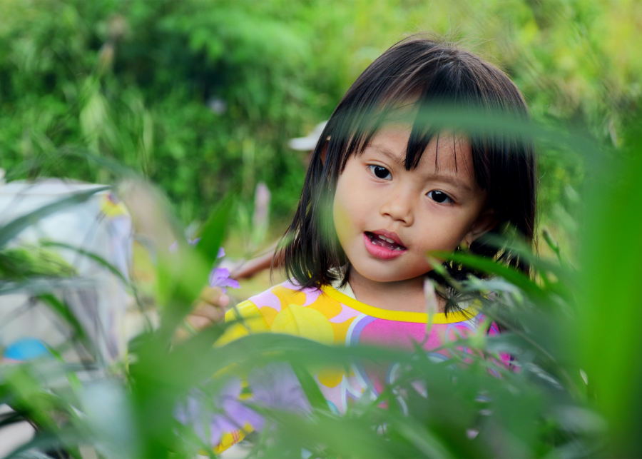 girl surrounded by plants