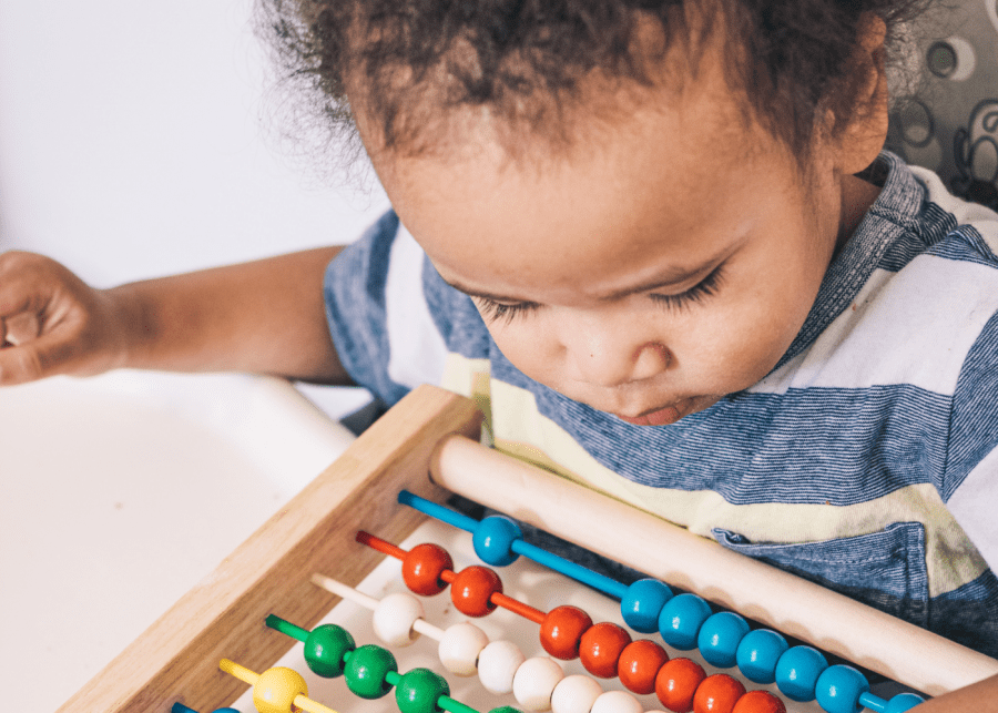 boy in blue and white shirt playing