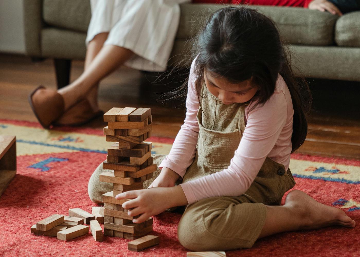 girl playing daughter blocks