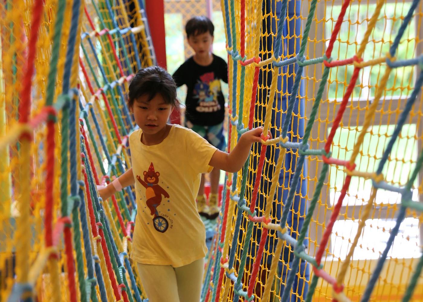 kids tweens playing indoor playground
