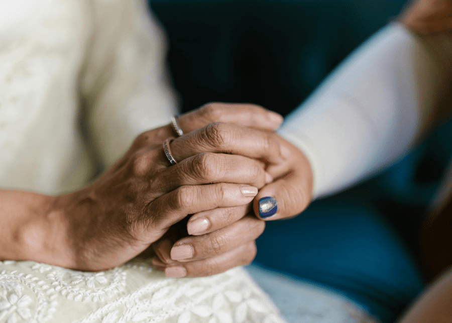 caregiver burnout holding hands