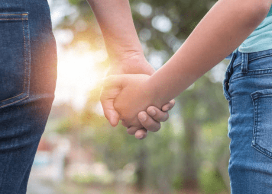 Teen and adult holding hands parents supervision how to help my kid with social media