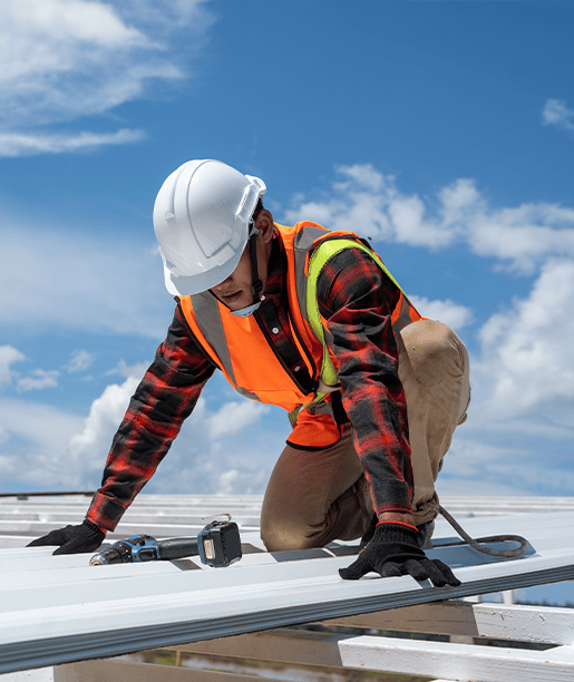worker roofing