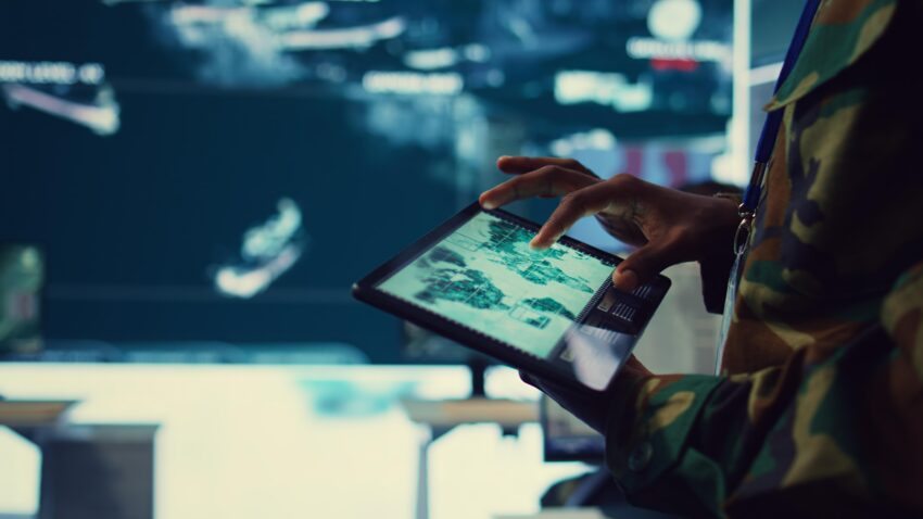 compressed army soldier reviews targets satellite world map ensure global protection