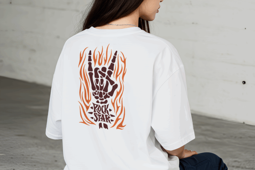 A woman wearing a white t shirt with a fiery hand in a rock gesture and 22Rock Star22 text on the back 1536x1024 1