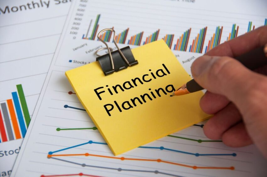 financial planning text yellow notepad with financial data analysis background financial planning concept 1 scaled 1