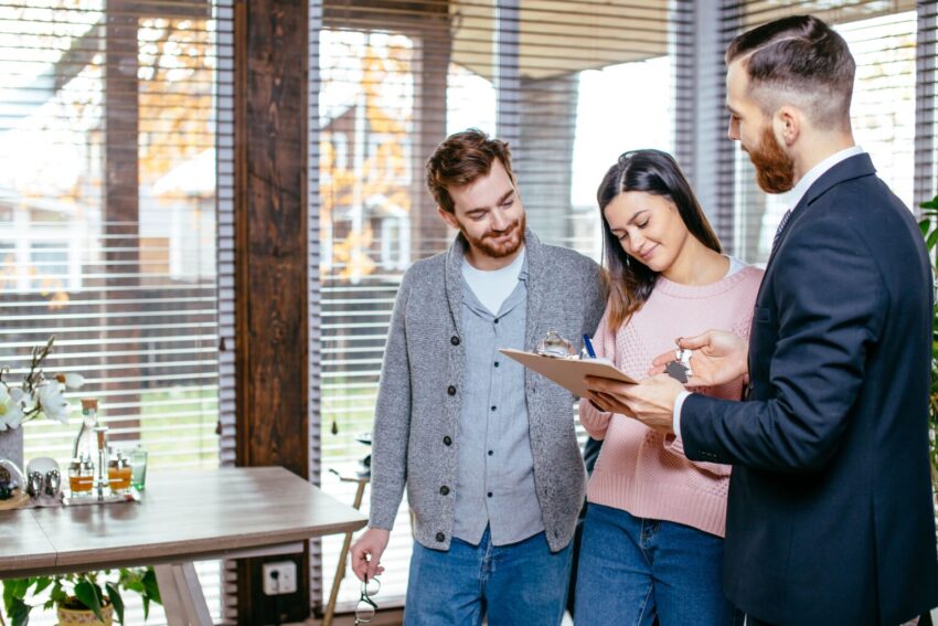 couple customers signing papers with mortgage brok 2026 01 09 01 13 52 utc 1 1536x1024 1