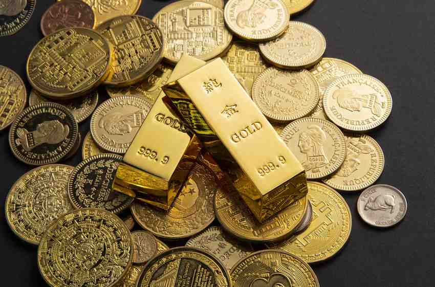 coins gold bars scattered table 1