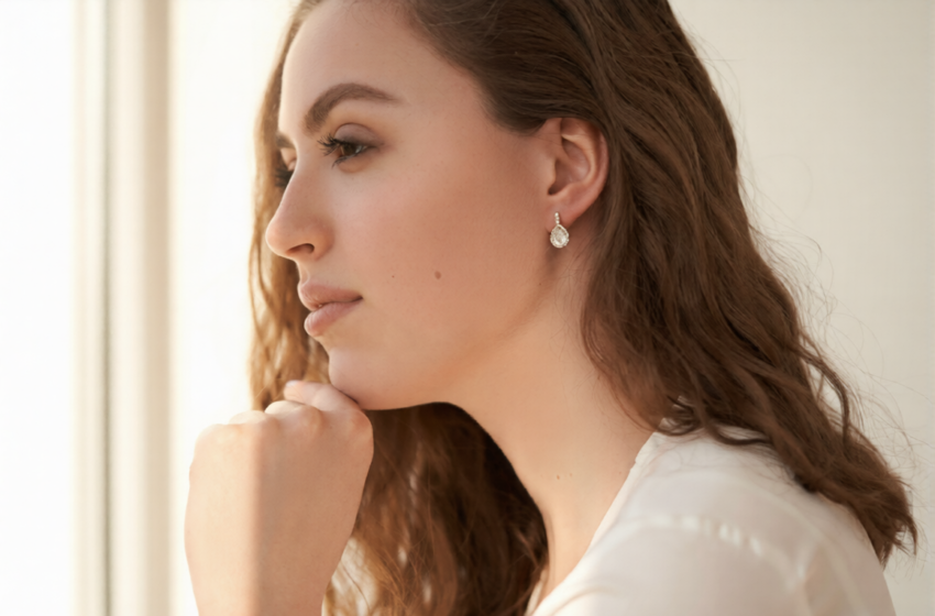 stock photo fashionable portrait of a young beautiful girl with jewelry earrings with white crystals and 1764347897 ezremove