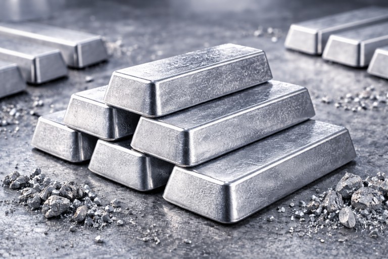 Aluminum ingots on a metallic surface