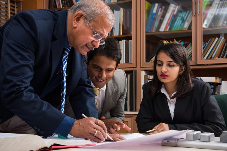 team indian architects builders drafting discussing housing project with building model plan around conference table selective focus 466689 15340