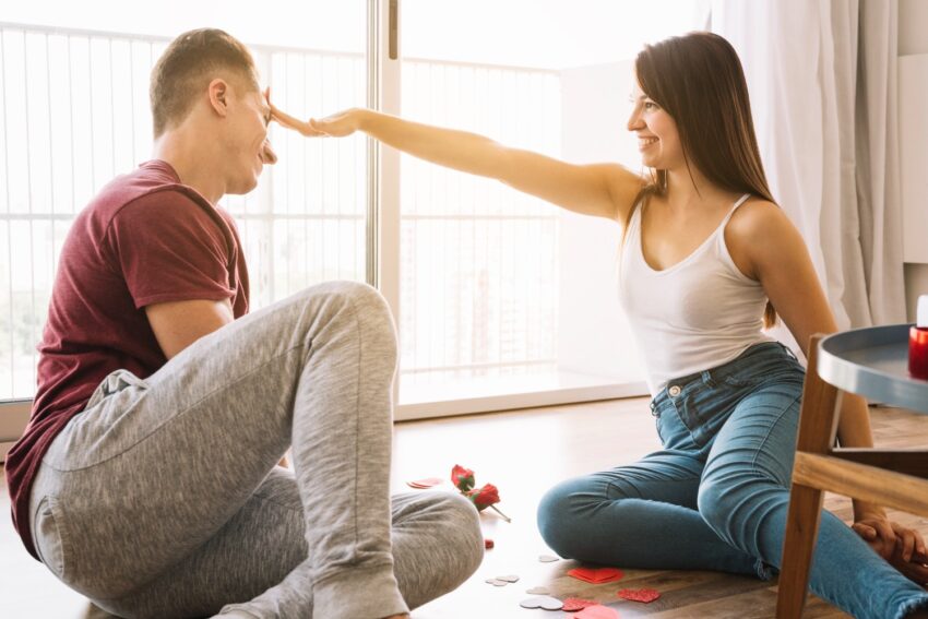 woman touching head man with hand 2000kb